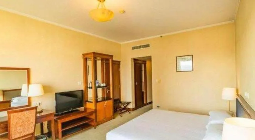 Bed in New Century Hotel Ninghai