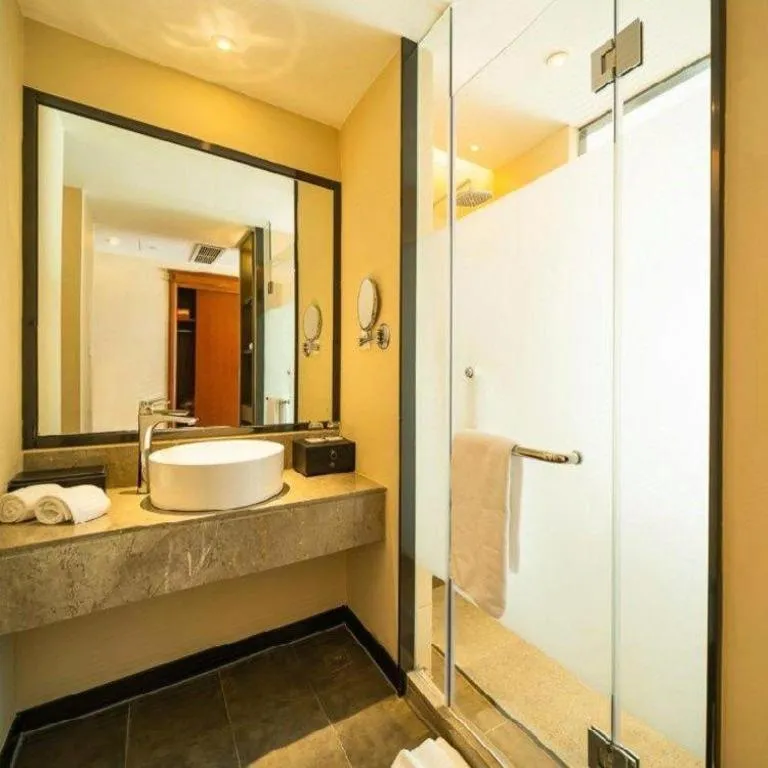 Bed in New Century Hotel Ninghai