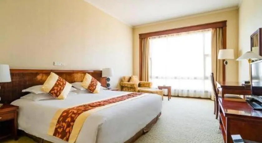 Bed in New Century Hotel Ninghai