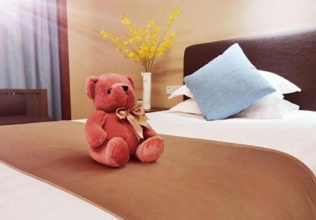 Bed in New Century Hotel Ninghai