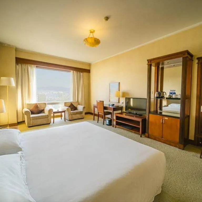 Bed in New Century Hotel Ninghai