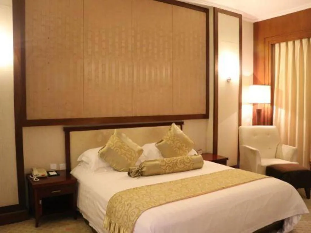 Bed in New Century Hotel Ninghai