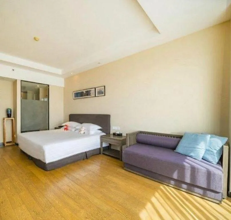 Bed in New Century Hotel Ninghai