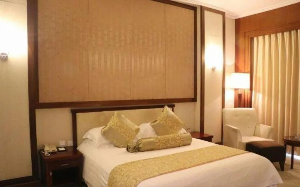 Bed in New Century Hotel Ninghai