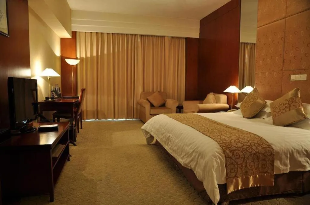 Bed in New Century Hotel Ninghai