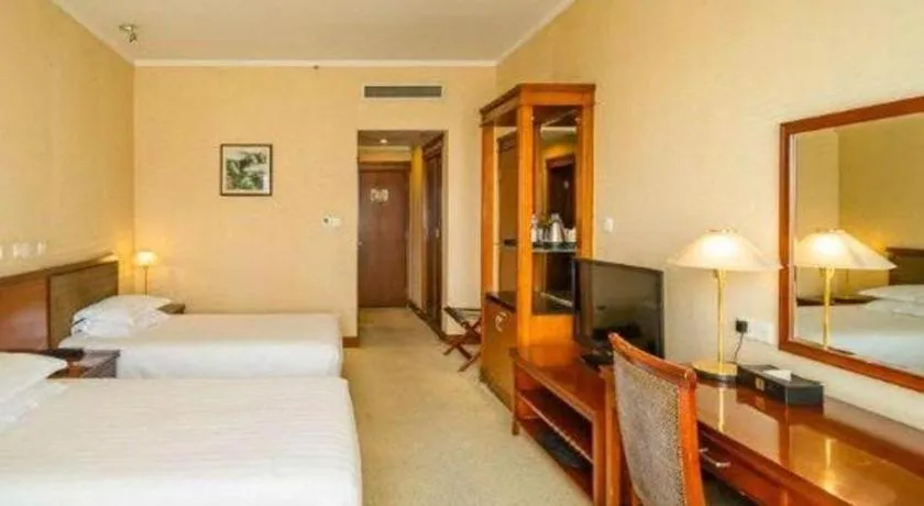 Bed in New Century Hotel Ninghai