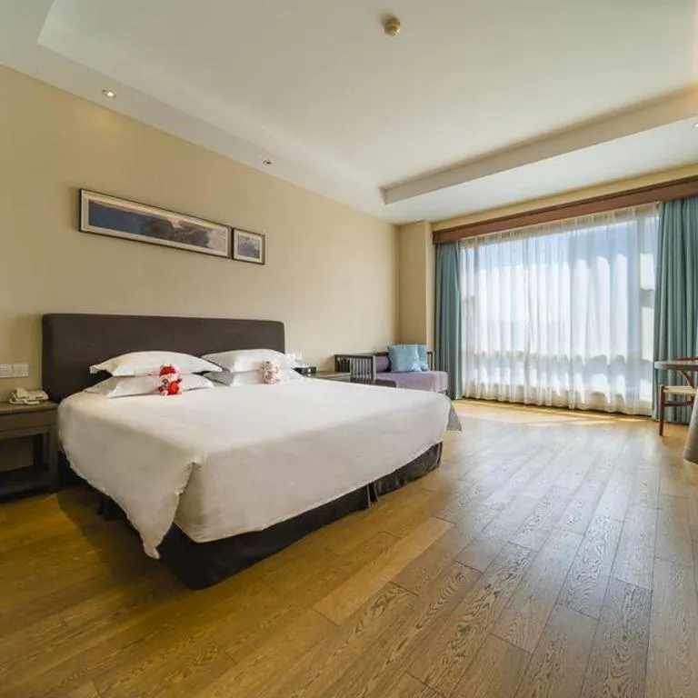Bed in New Century Hotel Ninghai