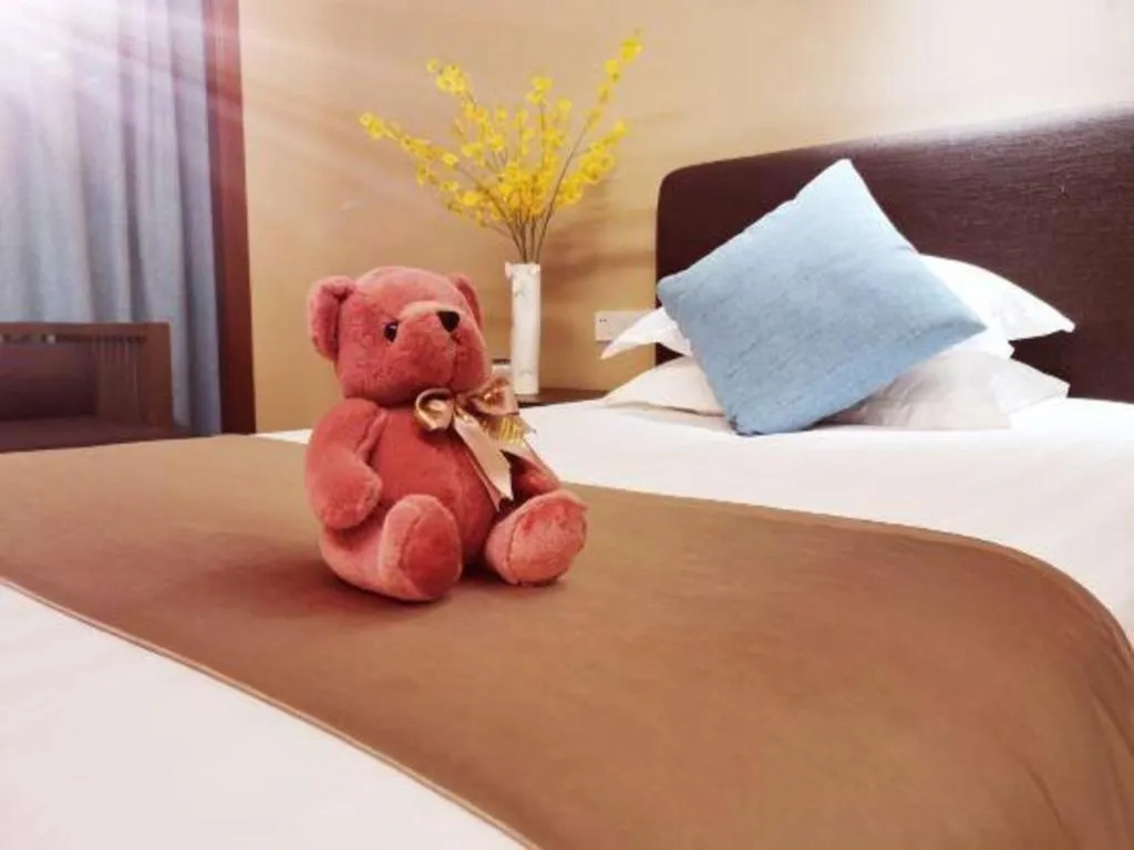 Bed in New Century Hotel Ninghai