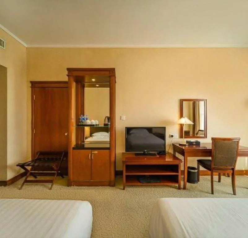 Bed in New Century Hotel Ninghai