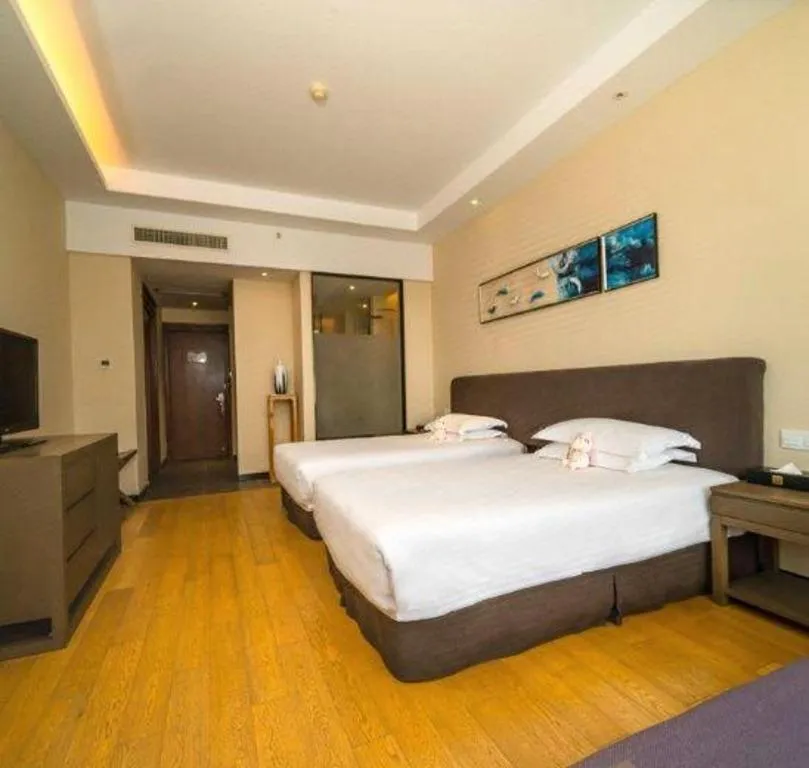 Bed in New Century Hotel Ninghai