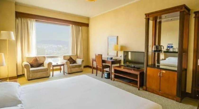 Bed in New Century Hotel Ninghai