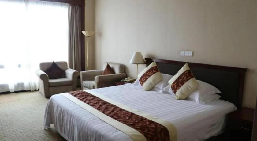 Bed in New Century Hotel Ninghai