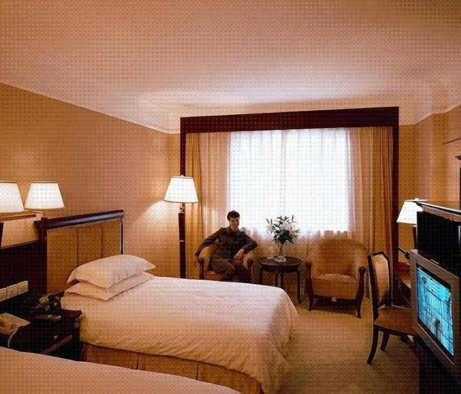 Bed in New Century Hotel Taizhou