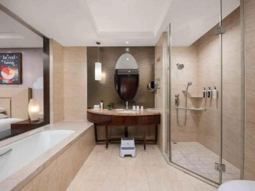 Bed in New Century Grand Changchun Hotel