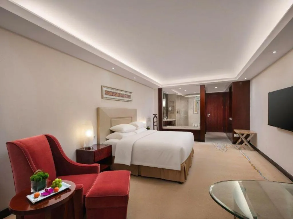 Bed in New Century Grand Changchun Hotel