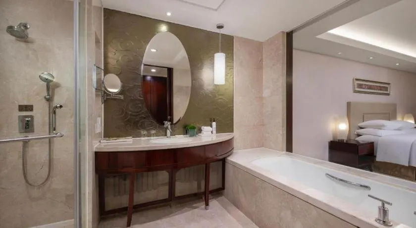 Bed in New Century Grand Changchun Hotel