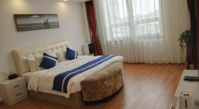 Bed in New Century Grand Changchun Hotel