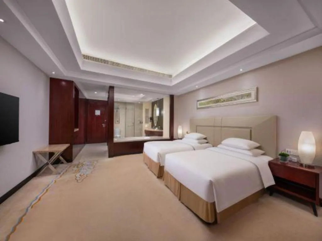 Bed in New Century Grand Changchun Hotel
