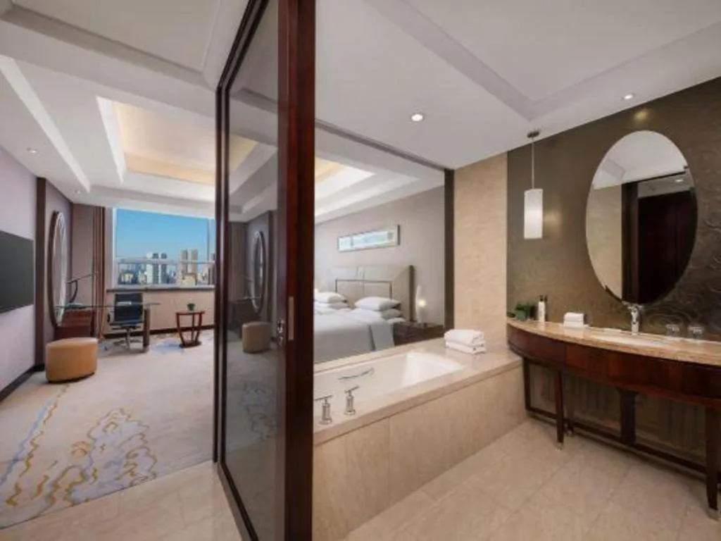 Bed in New Century Grand Changchun Hotel