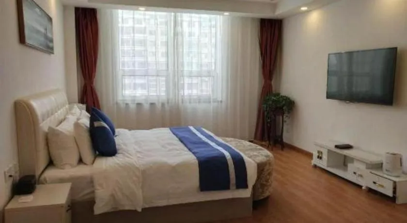 Bed in New Century Grand Changchun Hotel