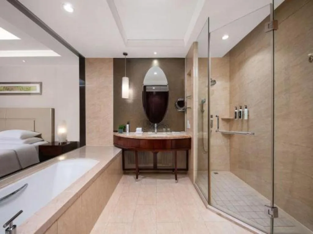 Bed in New Century Grand Changchun Hotel