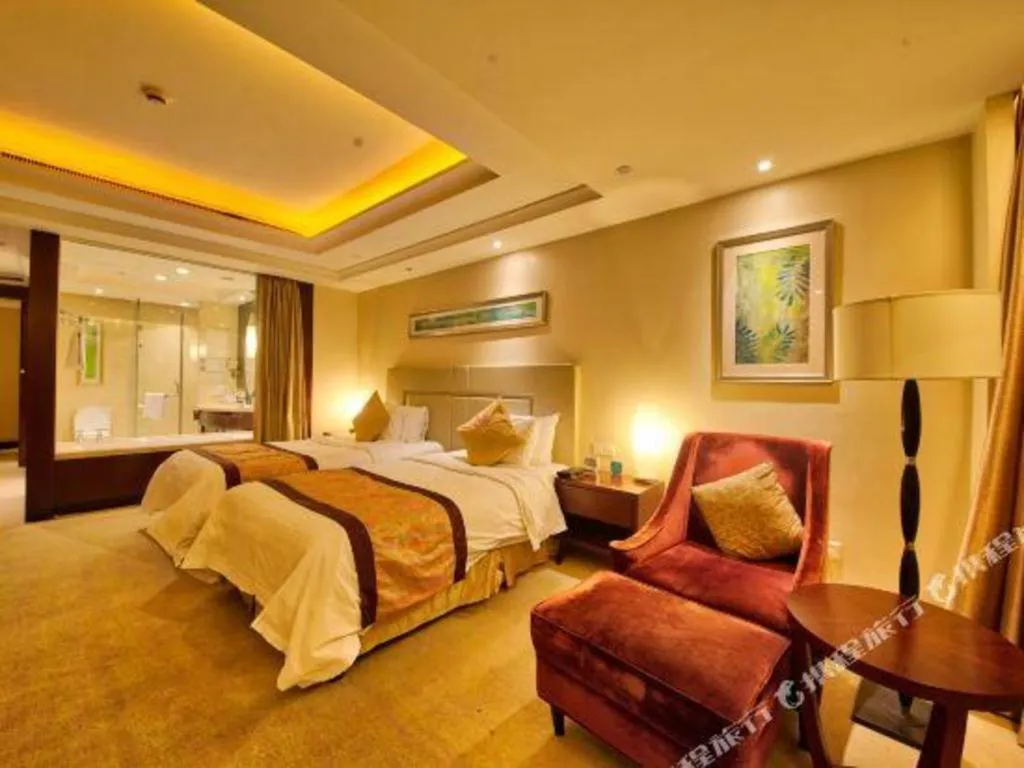 Bed in New Century Grand Changchun Hotel