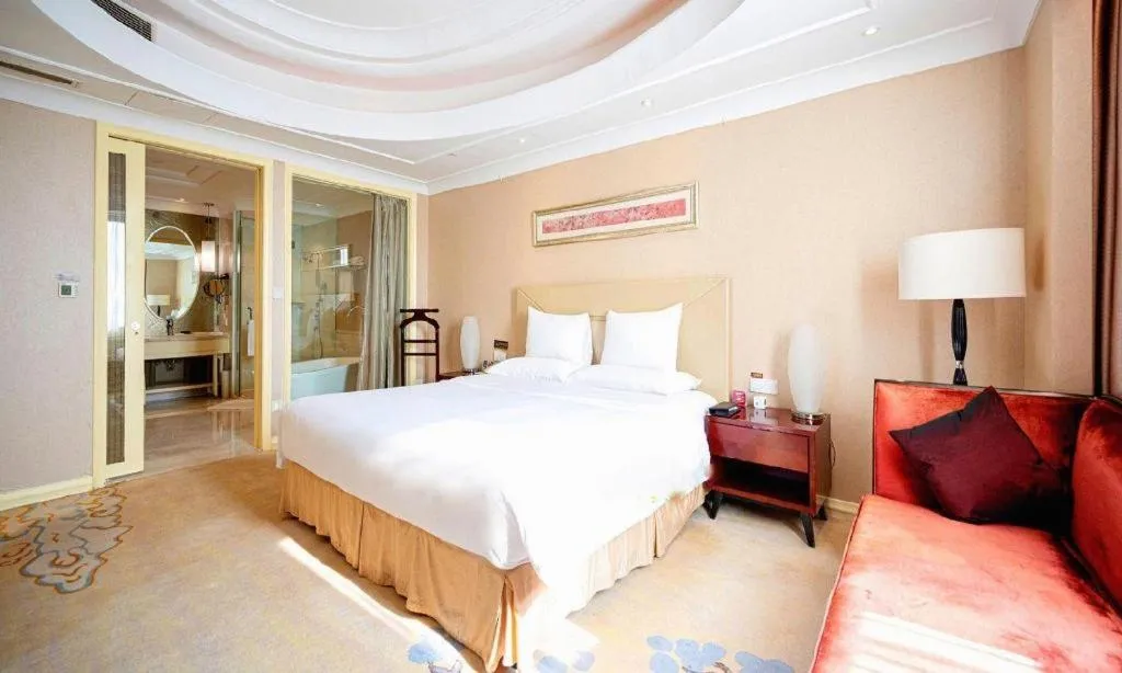 Bed in New Century Grand Changchun Hotel