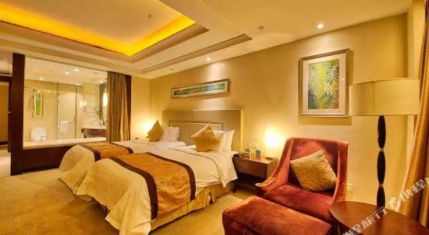 Bed in New Century Grand Changchun Hotel