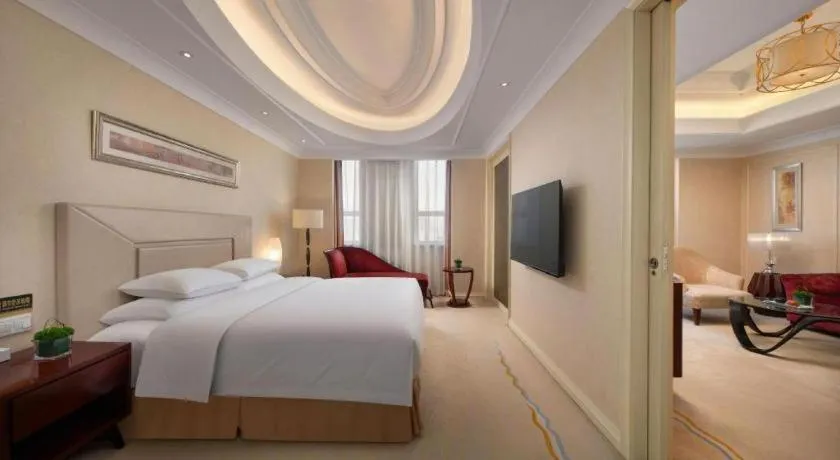 Bed in New Century Grand Changchun Hotel
