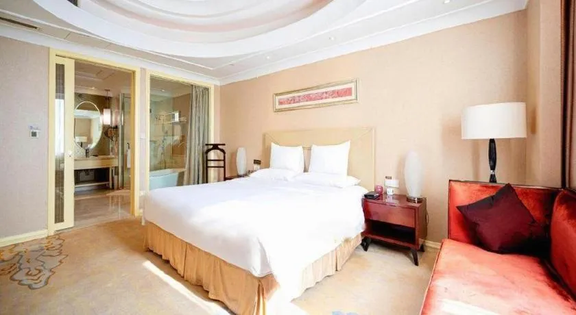 Bed in New Century Grand Changchun Hotel