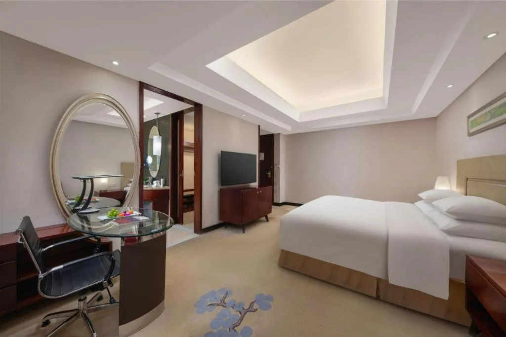 Bed in New Century Grand Changchun Hotel