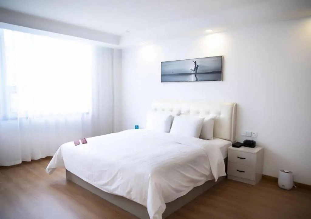 Bed in New Century Grand Changchun Hotel