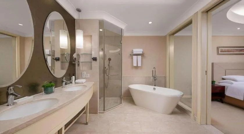 Bed in New Century Grand Changchun Hotel