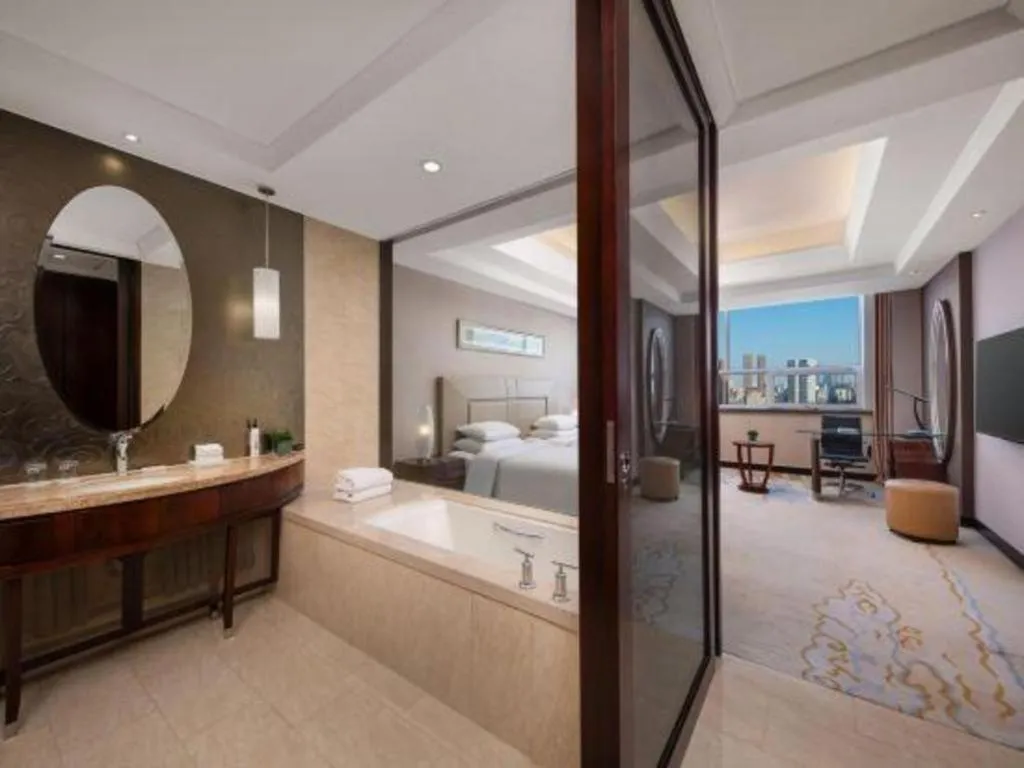 Bed in New Century Grand Changchun Hotel