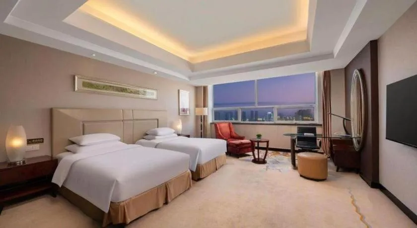 Bed in New Century Grand Changchun Hotel