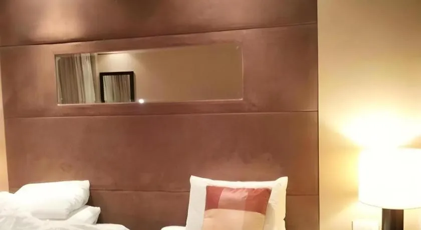 Bed in New Century Grand Hotel Xuzhou