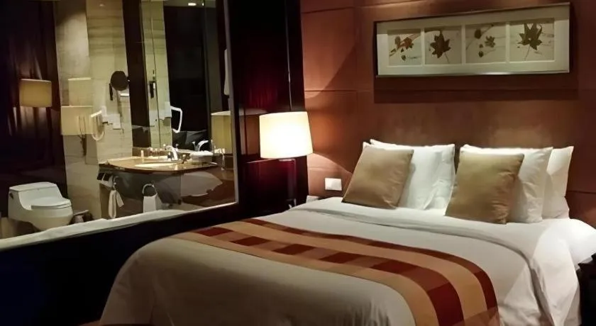 Bed in New Century Grand Hotel Xuzhou