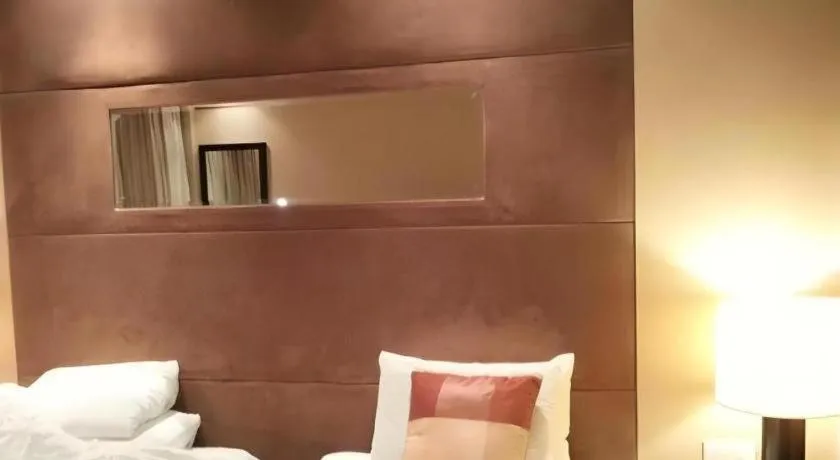 Bed in New Century Grand Hotel Xuzhou