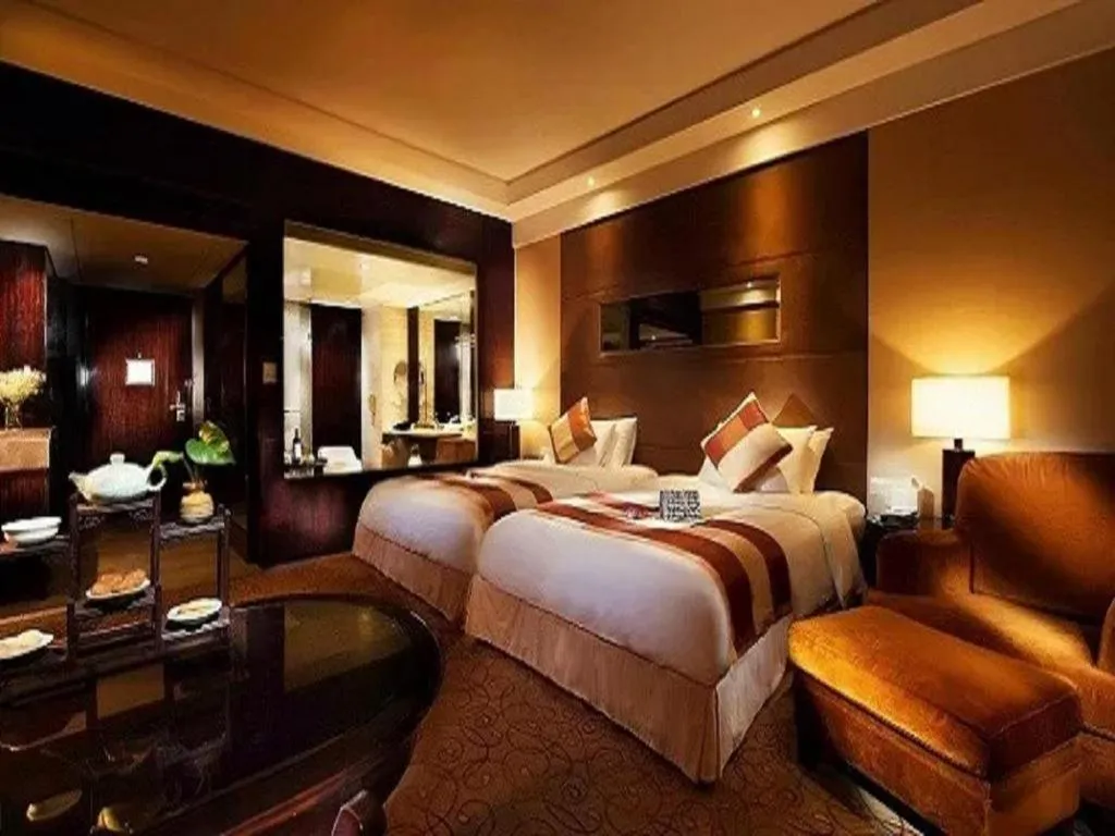 Bed in New Century Grand Hotel Xuzhou