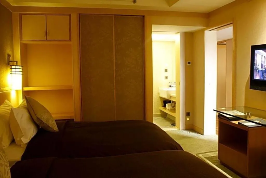 Bed in Xian Grand Noble Hotel