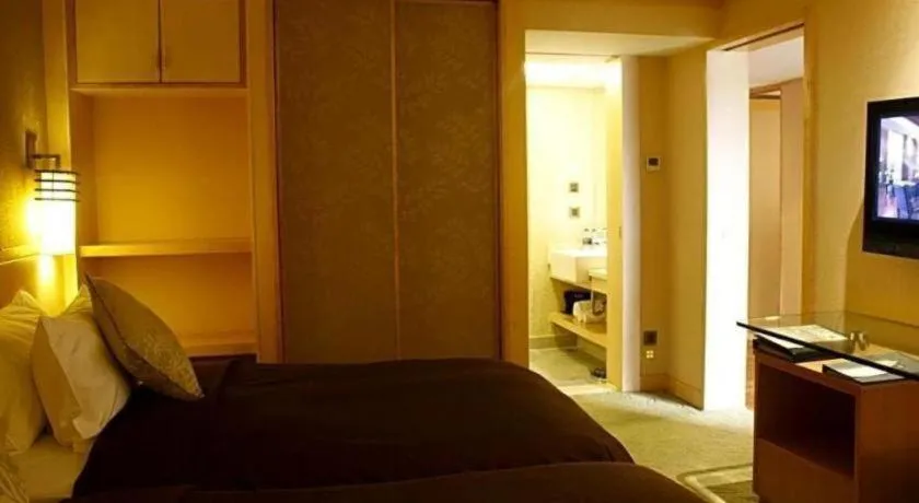 Bed in Xian Grand Noble Hotel