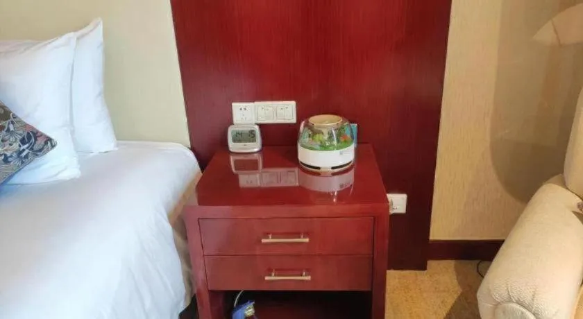 Bed in New Century Hotel Zaozhuang Fengming