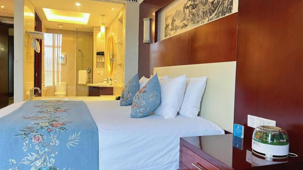 Bed in New Century Hotel Zaozhuang Fengming