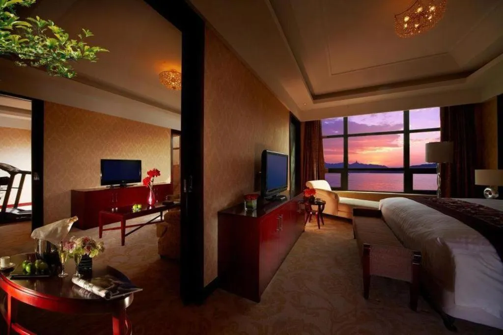 Bed in New Century Hotel Zaozhuang Fengming