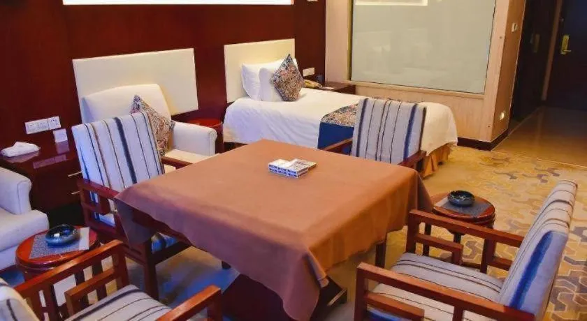 Bed in New Century Hotel Zaozhuang Fengming