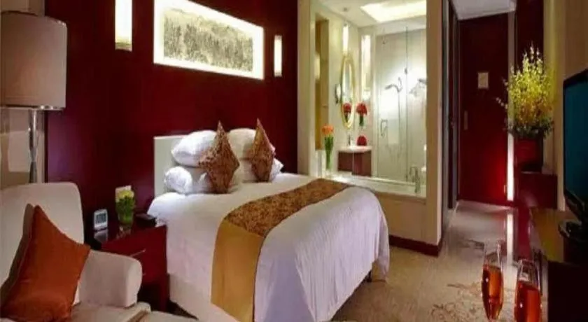 Bed in New Century Hotel Zaozhuang Fengming