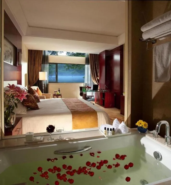 Bed in New Century Hotel Zaozhuang Fengming