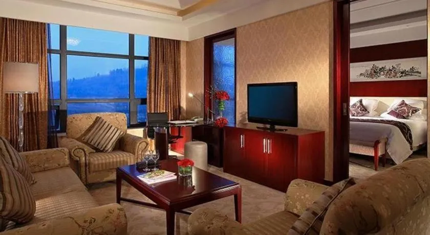 Bed in New Century Hotel Zaozhuang Fengming