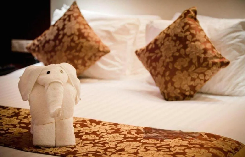 Bed in New Century Hotel Zaozhuang Fengming