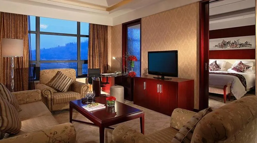 Bed in New Century Hotel Zaozhuang Fengming